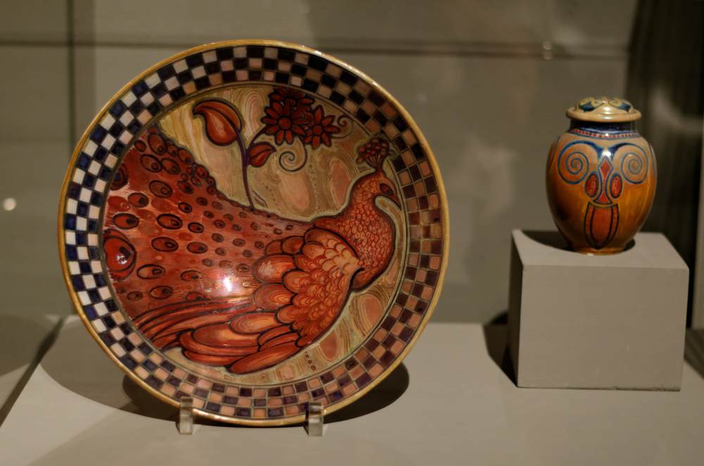 Decorative plate with peacock and lidded vessel by CHINI, Galileo