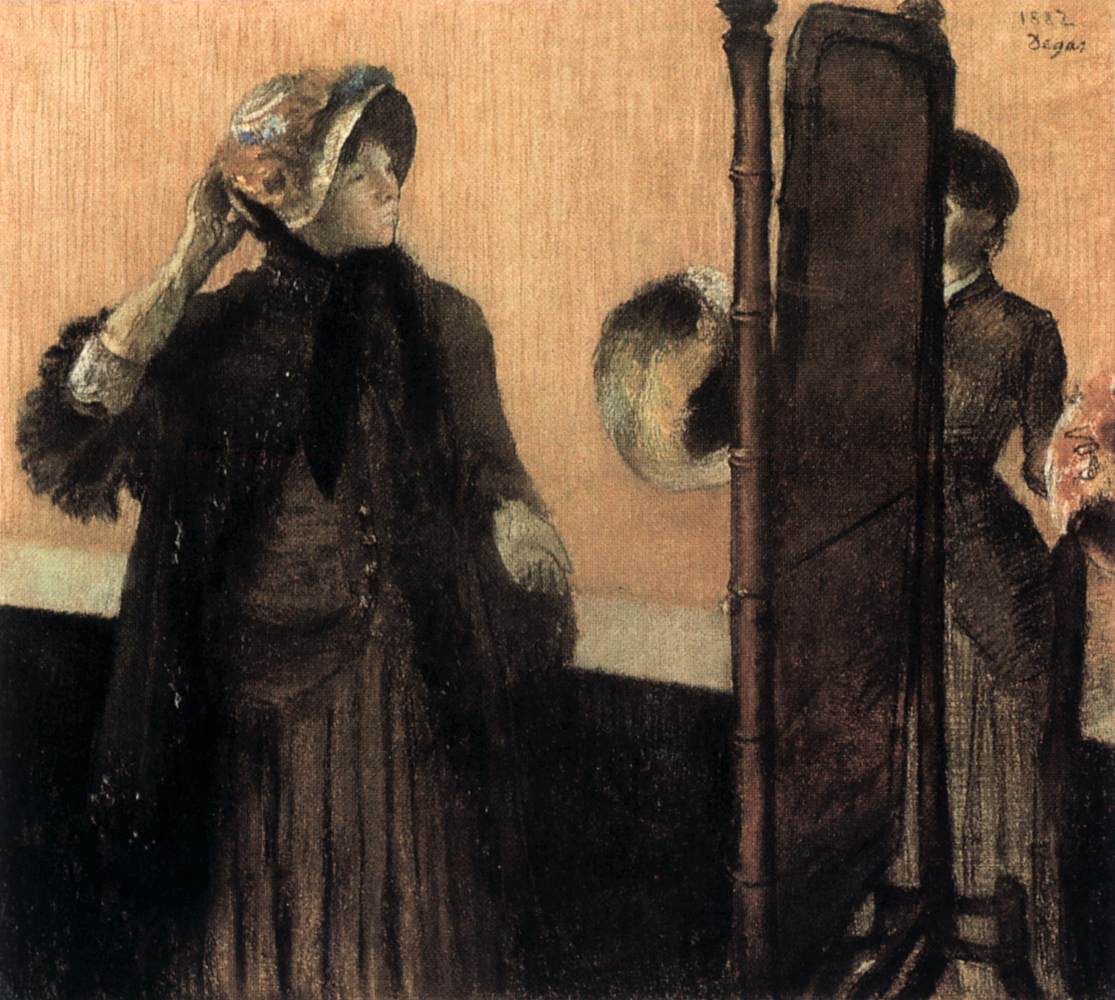 At the Milliner's by DEGAS, Edgar